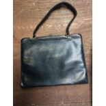 Ladies leather handbag & a three quarter length fur coat