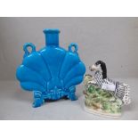 Blue fan shaped blue vase with handles to neck and on raised feet, stamped Minton on base & a