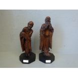 Pair of Chinese rootwood carved figures of scholars on octagonal bases 33H & 31H cm