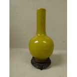 Chinese yellow crackle glazed bottle vase on stand with Kangxi character marks to base, 22 cm H