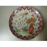 Oriental plate in the Imari pallette, decorated with vase and flowers and birds, impressed marks and