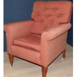 Reproduction Victorian style armchair on mahogany legs to casters