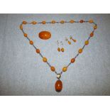 Amber & white metal beaded necklaces, 2 pairs of amber earrings & amber brooch, 65g