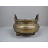 Chinese twin handled bronze censer, with character marks to base, 20 cm dia.