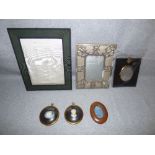 A selection of old portrait and photograph frames and two cameos