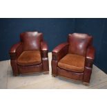 A pair of club style leather armchairs, possibly 1920's with later covering and alterations in parts