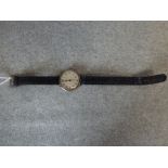 Ladies silver cased wrist watch by 'Heming of London' with signed Rolex movement on black leather