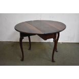 Small George III mahogany oval drop leaf, gate leg, dining table on carved cabriole legs with