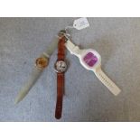 3 Watches: 'Wallace and Gromit' with leather strap, transparent 'Swatch' with gold coloured movement