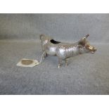 Silver cow creamer, London import marks for 1973, of usual form, 14 cm long, 18g gross (6 ozt)