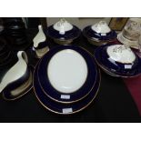 Wedgwood blue & white, & gilded, part dinner service of 2 sauce boats, 4 meat plates & 3 tureens (