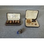 Pair of cufflinks, the oval monogrammed panels stamped '9ct', with a pair of 9 carat gold cufflinks,