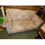 Edwardian 2 seater sofa upholstered floral fabric on mahogany legs to castors 70 x 145 cm (some