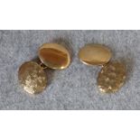 Pair of 9 carat gold cufflinks with one textured oval panel and one plain, 13g gross