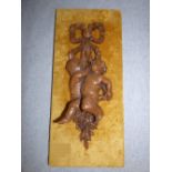 Victorian carved oak wall plaque of cherubs