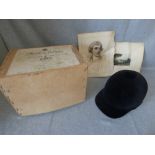 A riding hat, boxed