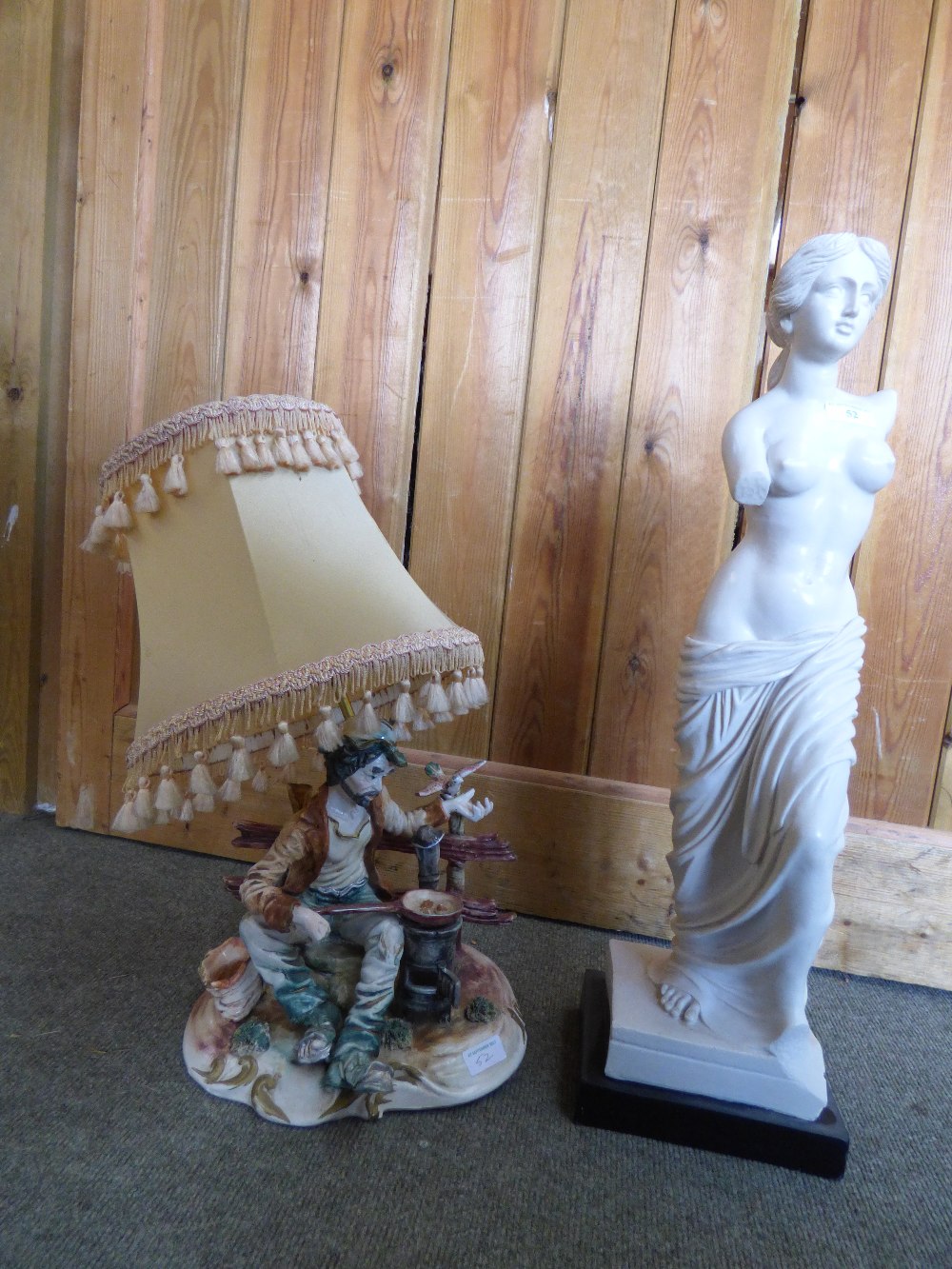 Resin figure of a lady & a table lamp
