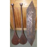 Indonesian Dayak hardwood carved shield & pair of tribal hand paddles