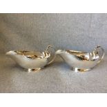 A large pair of Danish design Arts & Crafts oval silver sauce boats with cast leaf & bead capped