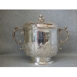 A silver presentation cup and cover in the form of an oversized porringer, by 'J. B. Carrington'