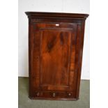 George III mahogany hanging corner cupboard with a small drawer