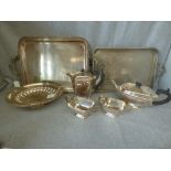 A silver plated four piece tea service; a two handled tray; a two handled rectangular gallery tray