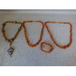 Row of amber beads, another row of amber beads and an elasticated amber bead bracelet, 68g gross;