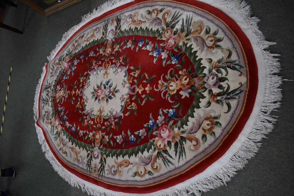 Oval washed Chinese rugs, red and cream with floral decoration 250 x 170 cm & faded gold with floral