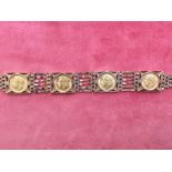 9 carat gold bracelet set with four half sovereigns for 1912 & 1915, 34.6g gross in a a 'Boodle &
