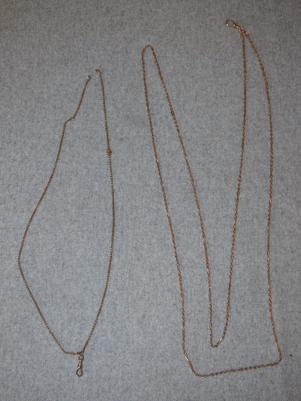 Long chain, tagged '9c', of fancy links, 143 cm long, 22.6g gross; with a past guard chain,