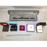 Collection of five gem set, 9 carat, gold rings; a pair of ear studs; a silver diamond set