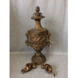 Gilt metal urn with embossed decoration of cherubs in Regency style 40H cm (general scratches/