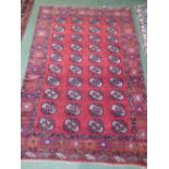 Middle Eastern rug with red background & geometric pattern, 148 x 232 cm (signature in weave)