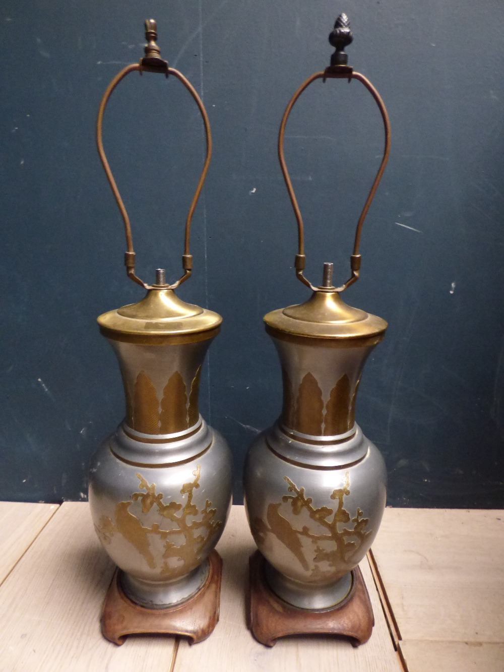 Pair Chinese tin and brass table lamps with floral and bird decoration on wooden stands