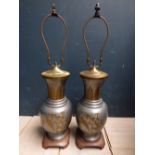 Pair Chinese tin and brass table lamps with floral and bird decoration on wooden stands