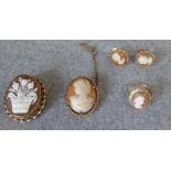 Collection of 9 carat gold shell cameo jewellery, comprising two brooches, a ring and a pair of