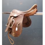 Good quality leather polo saddle with leathers and irons