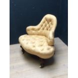 Button back ladies Spinsters chair in gold upholstery & mahogany legs to castors