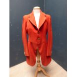 Red hunting coat, with brass buttons, bears label Jones Chalk & Dawson, 6 Sackerville St