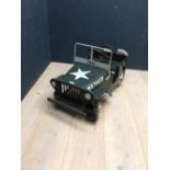 Pedal car as a U.S. Army Jeep painted in Army khaki green with Jerry can and spare wheel on back
