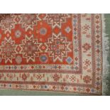 Persian rug, crimson and beige ground 214 x 130 cm