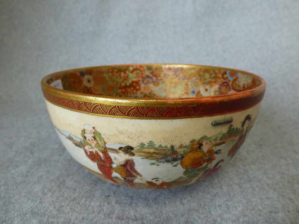 Japanese bowl with flowers and cherubs. Character marks on base