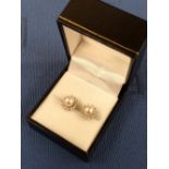 A pair of cultured pearl and diamond cluster ear studs,18 carat white gold, the 6.5mm diameter pearl