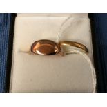 Continental wedding ring, stamped '18', 1.6g gross; with a signet ring, indistinctly marked, 2.5g