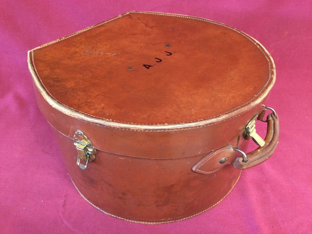 Ladies, 1920's, round leather hat box with carrying handle & green satin interior