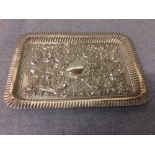 Hallmarked silver oblong embossed tray of Rococo decoration, 27cm L