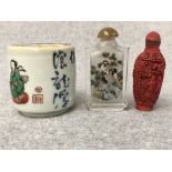 Red carved cinebar snuff bottle, a glass snuff bottle, and a small chinese pot Please check