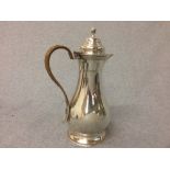Hallmarked silver hot water jug with cane handle, London 1919, 17 ozt