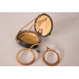 C19th Chinese horn folding glasses and a leather case. Provenance: From the Collection of Seward