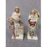 Pair of Staffordshire figurines of ladies with children, 19cm H